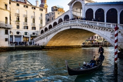 Gondola Transport on Channel with Rialto Bridge Venice Italy